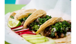 a close up shot of tacos on a plate