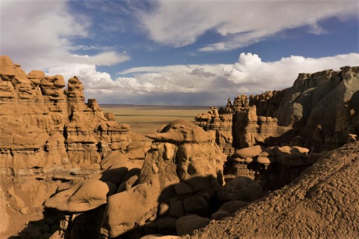 a landscape shot of rock formations in goblin valley state park